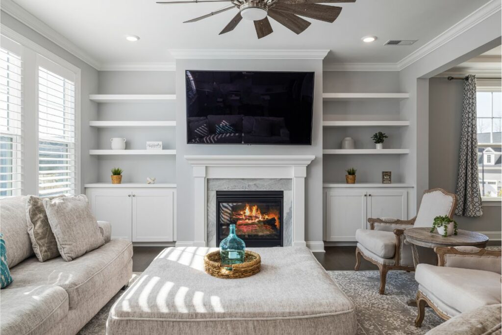 Tv and fireplace with white mantel