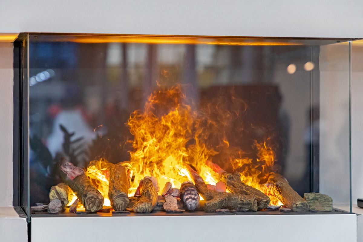 3 sided fireplace with glass surround