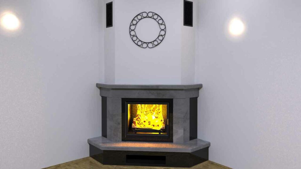 grey marble corner fireplace with wood burning. light grey walls. wood flooring.