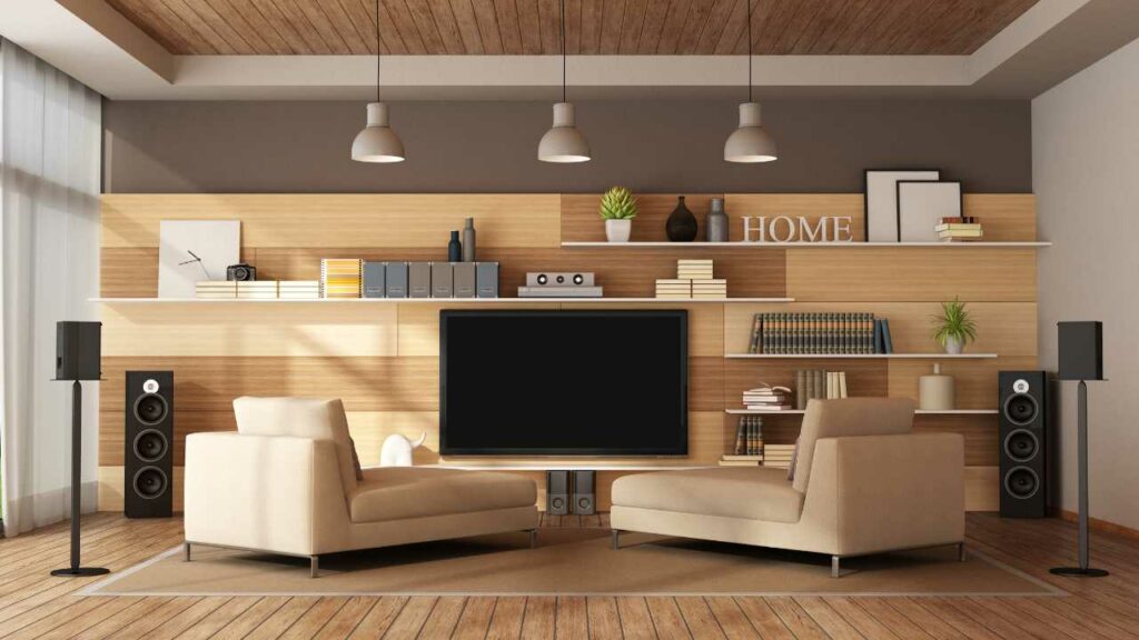 Wall TV Hanging. Cable box on shelving. Wood floor and wood walls. Modern stylish lokking living room.