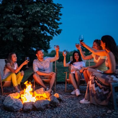 A group of friends enjoying a wood burning Fire Pit