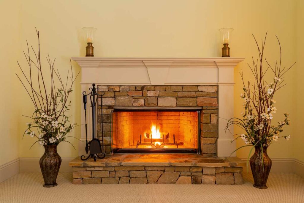 stone vaneer fireplace with wood burning