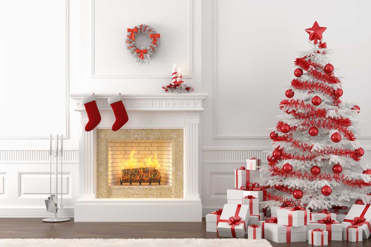 White washed fireplace with christmas tree and stocking