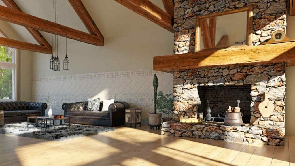 Rustic fireplace with stone surround and stone hearth. Wood bean floating mantel. Mirror above fireplace. large beams from ceiling. wood flooring.