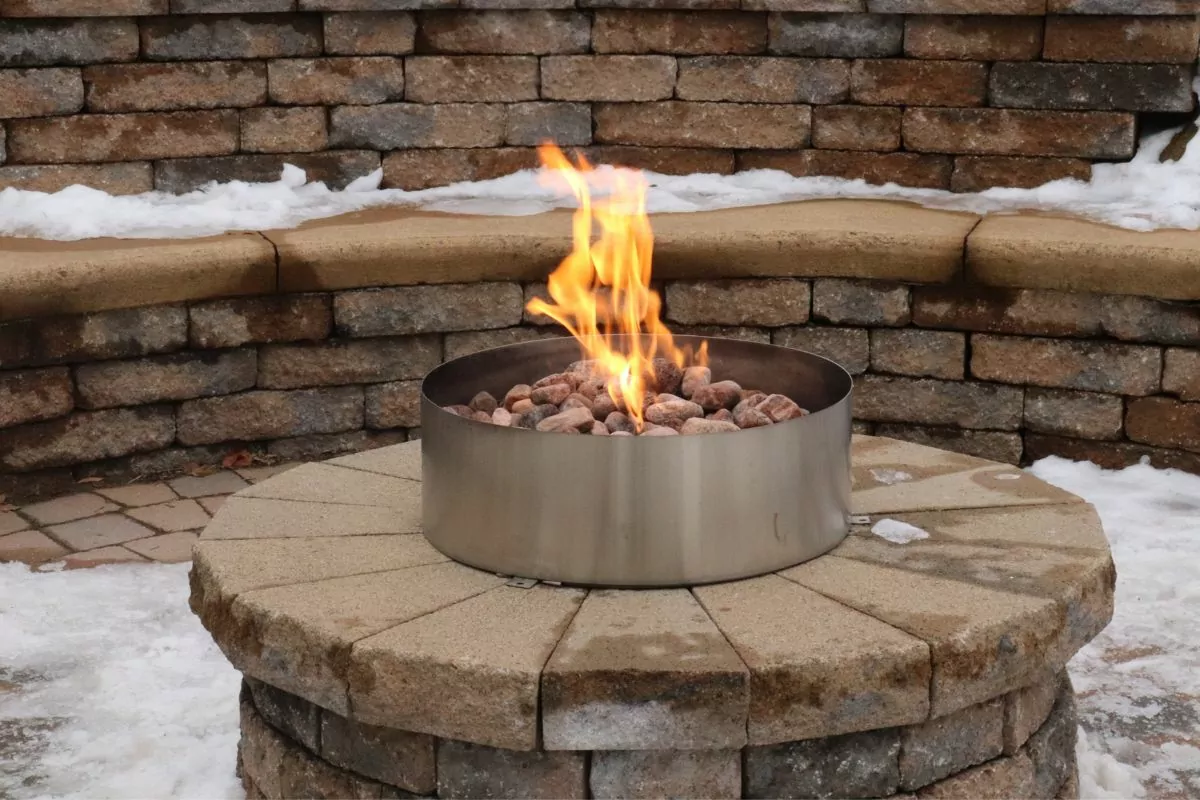 small outdoor table top bio ethanol burner with pebbles