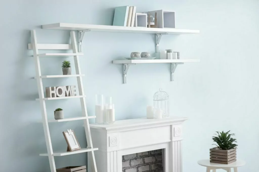 white surround fireplace with shelving above