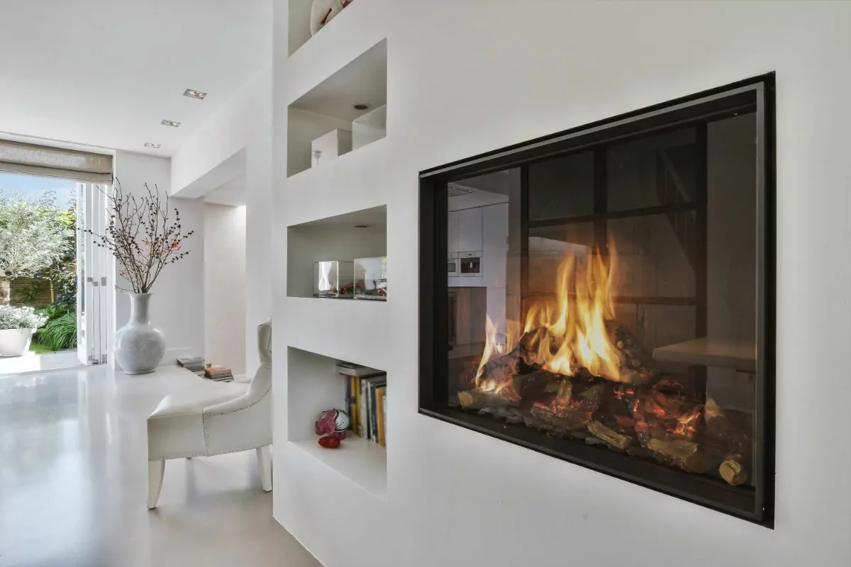 modern looking fireplace in a wll with alcove to the side
