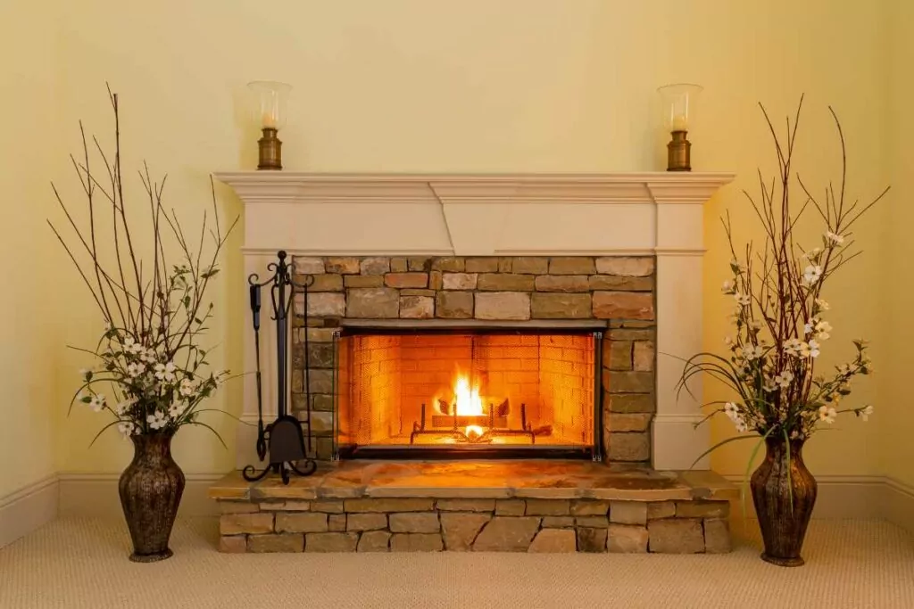stone vaneer fireplace with wood burning