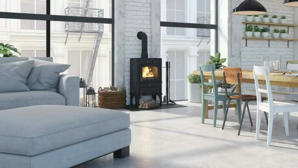 Modern wood birning fireplace. Vented through the wall. Modern apartment. White brick walls.